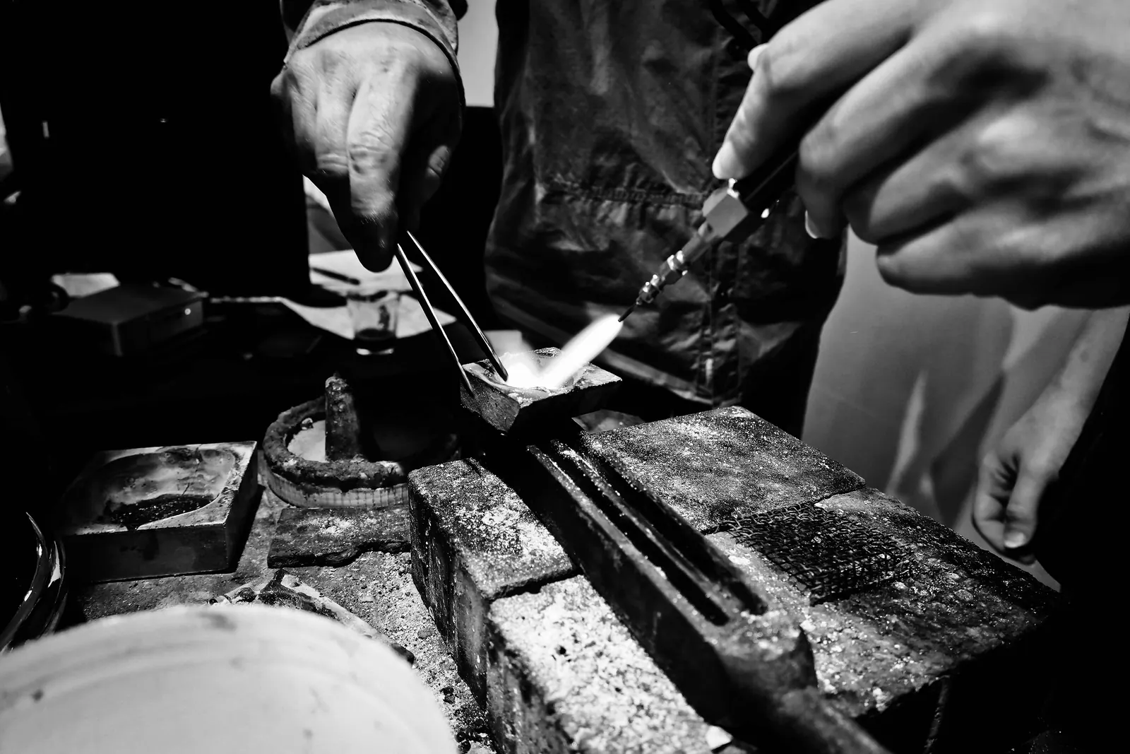 Silver being worked by hand at the jewellery bench