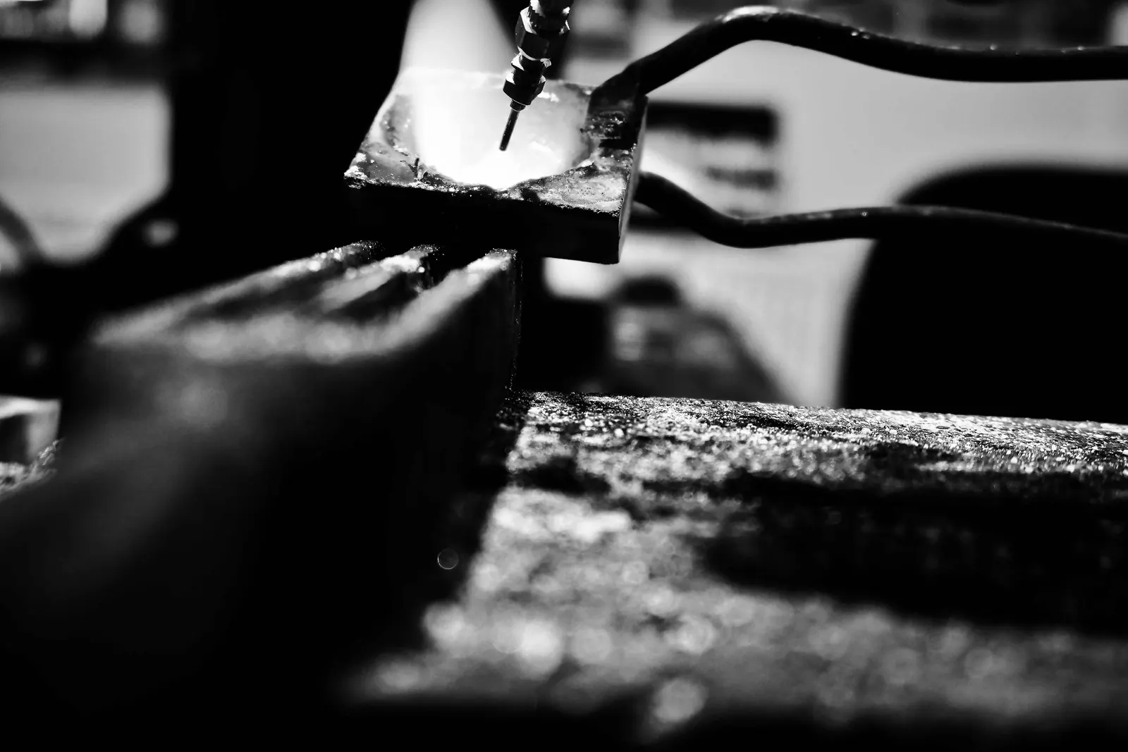Molten silver being heated at the jewellery bench